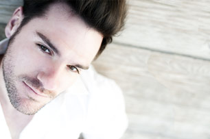 Male model laying on wood floor